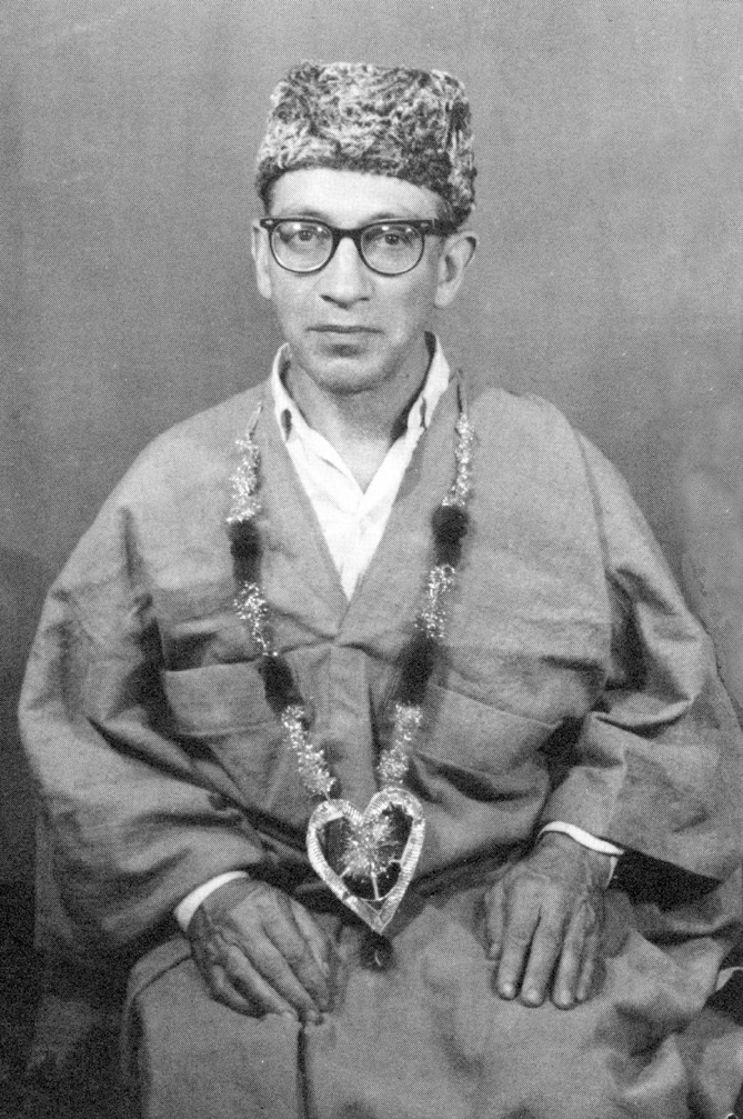 Murshid Samuel Lewis in robe and cap, 1962